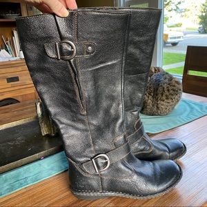 Black leather mid calf boots.